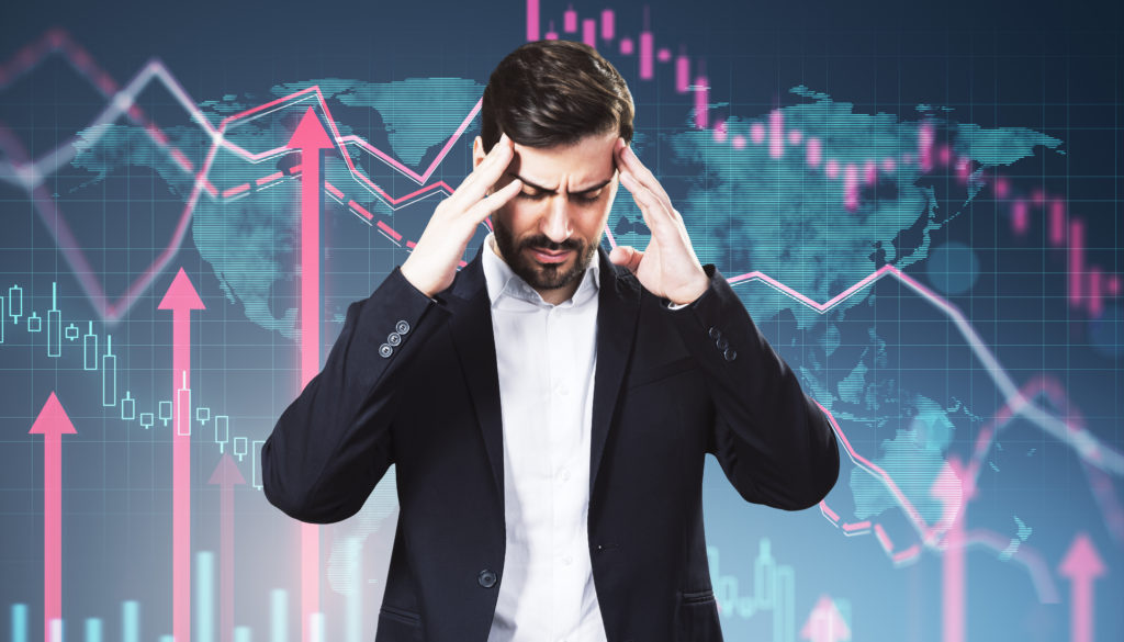 Portrait Of Stressed Young Man With Business Chart And Growing Red Arrows On Blurry Background. Financial Growth, Trade And Market Concept. Double Exposure. - Contabilidade em Santa Catarina | Amaral Contabilidade