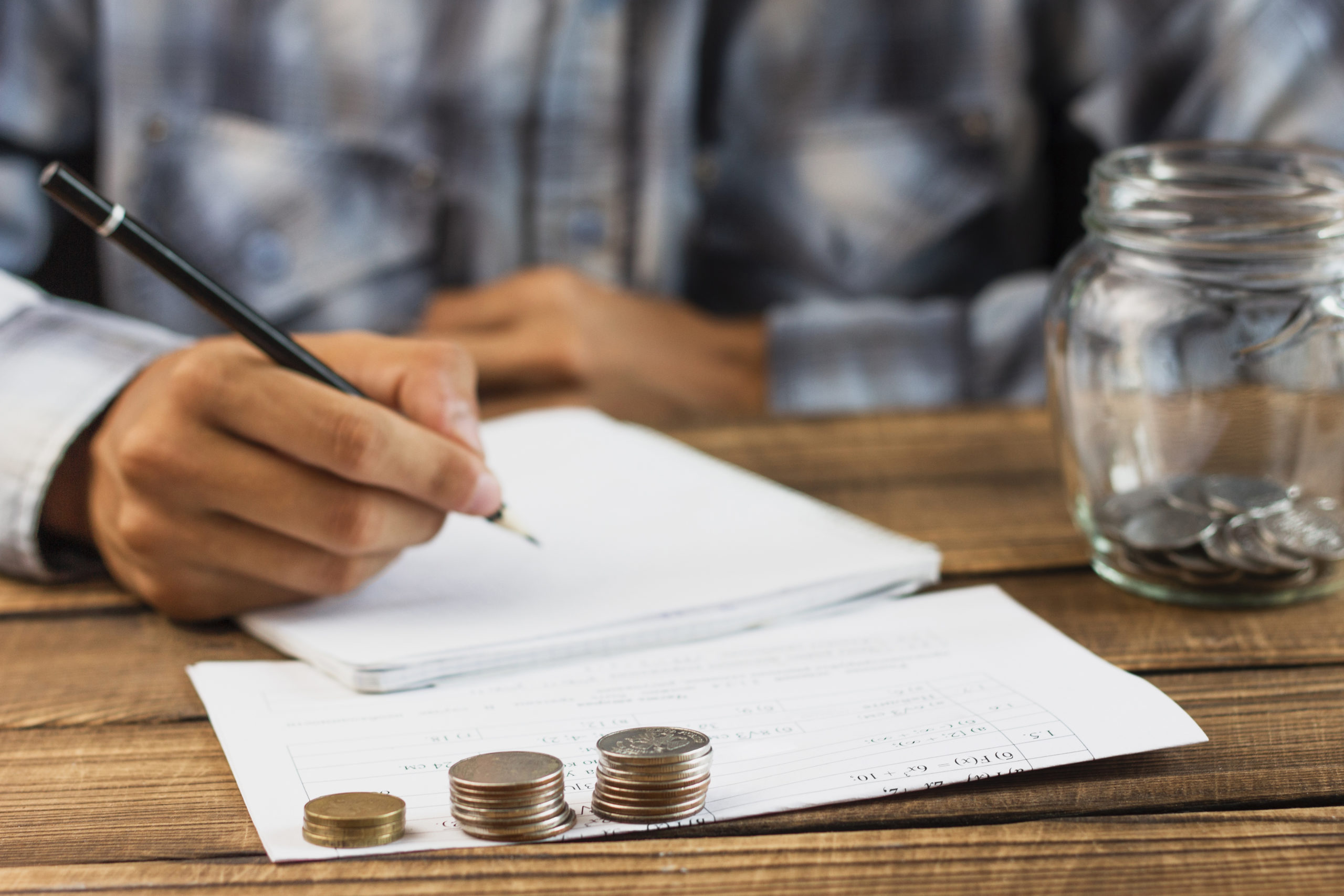Man With Saving Jar Counting - Contabilidade em Santa Catarina | Amaral Contabilidade